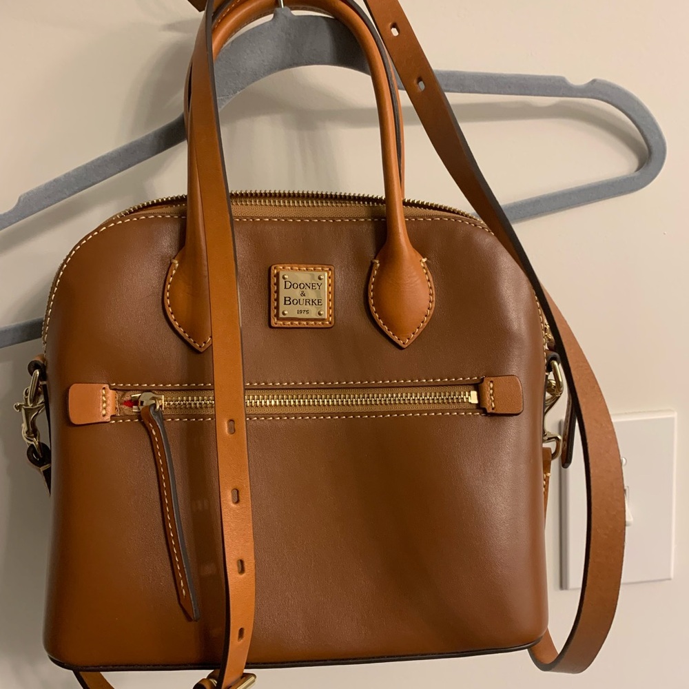 Dooney and Burke leather doomed satchel in natural.